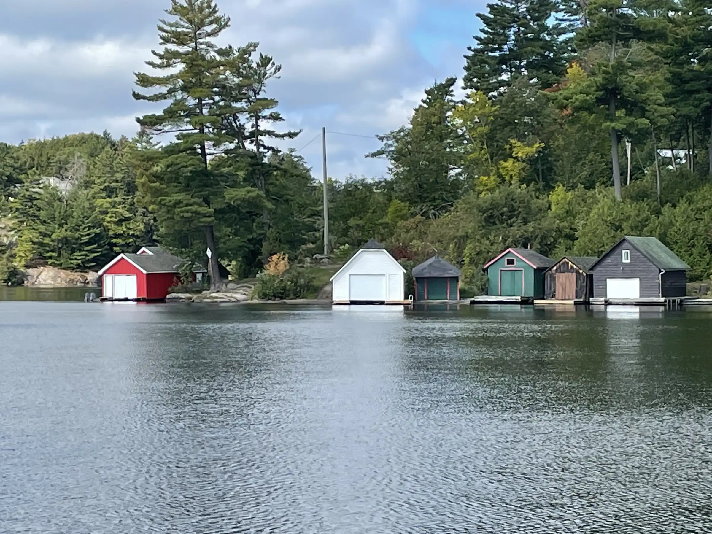 A row of old wood boat houses on Lake Rosseau.