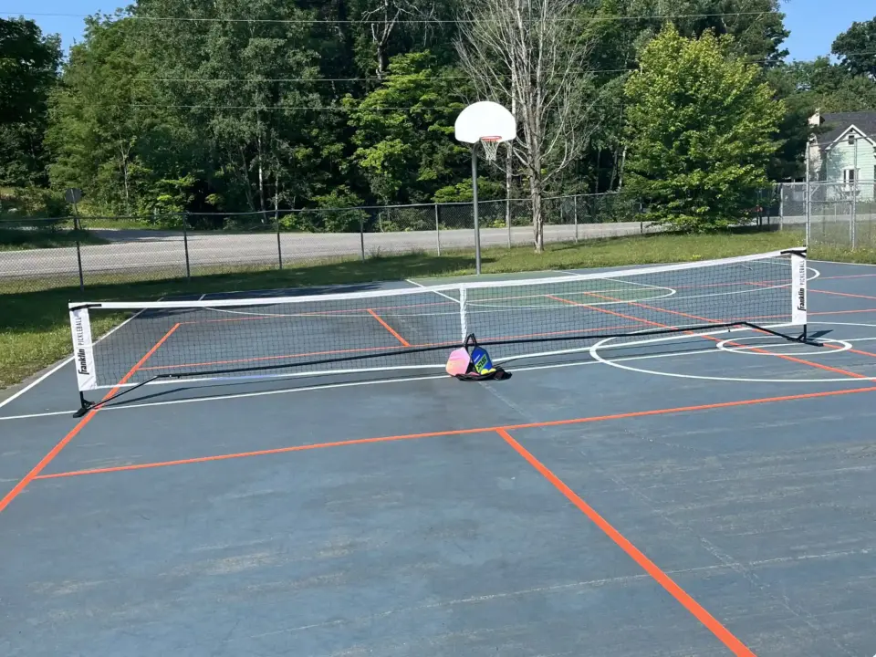 Pickleball setup on the basketball court in the village of Rosseau.