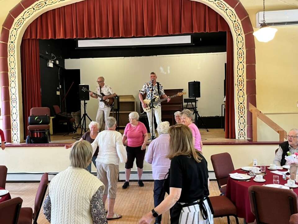 Rosseau caring community monthly lunch learn attendees music dancing 4x3 custom